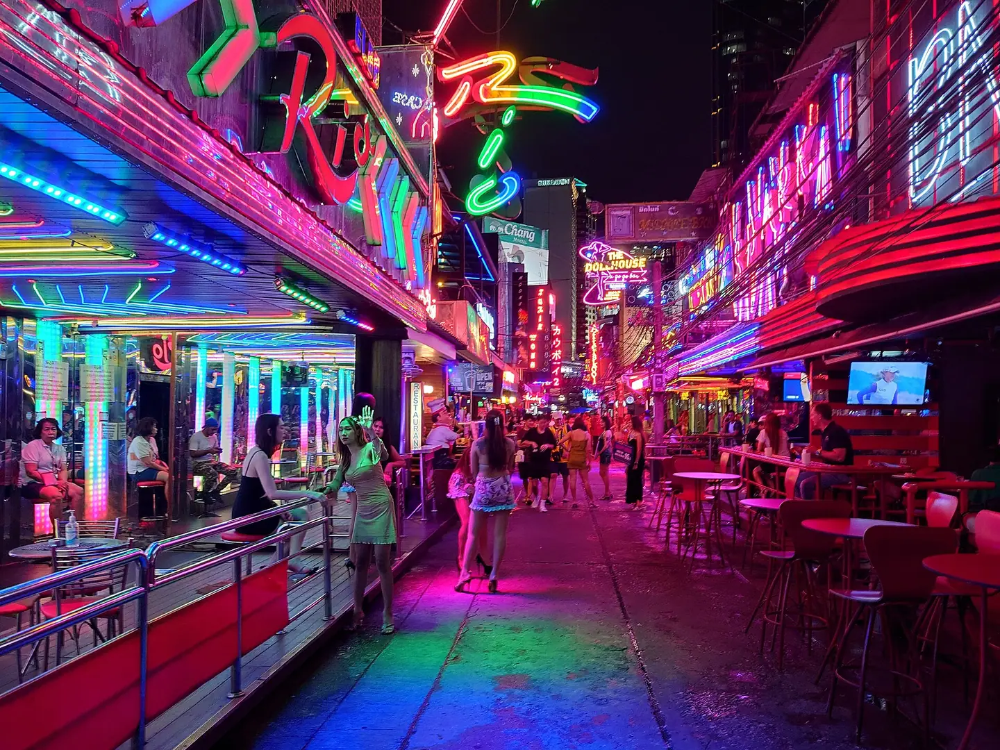 Adult women and visitors along the neon-lit Soi Cowboy nightlife street in Asok