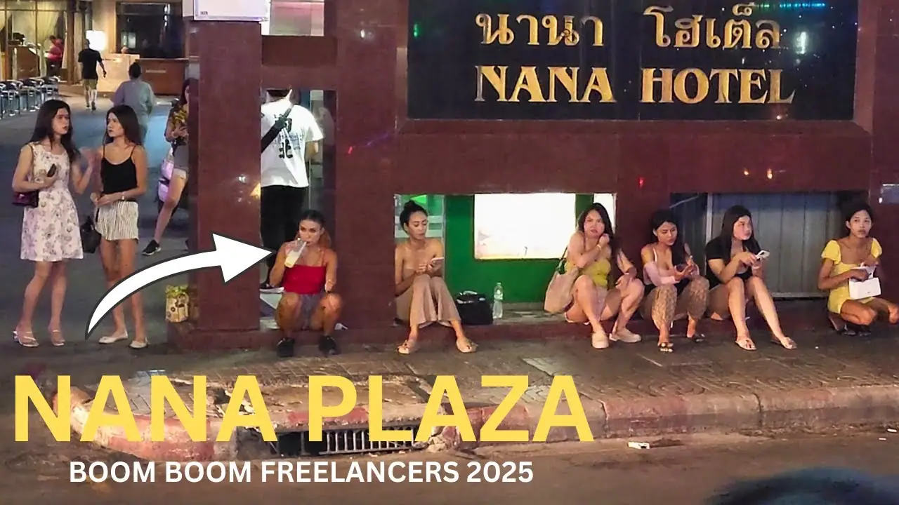 Adult women gathered along the street outside Nana Hotel at night